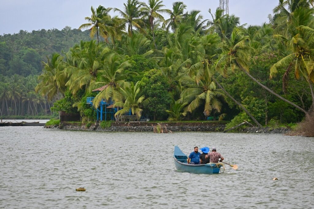 a group of people in a small boat on a lake